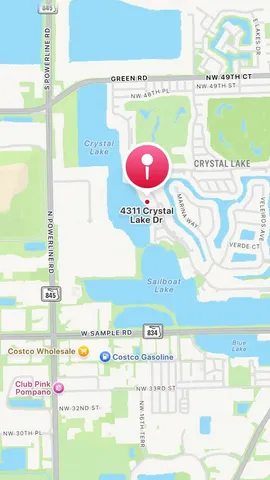 a kitchen with granite countertop white cabinets and stainless steel appliances