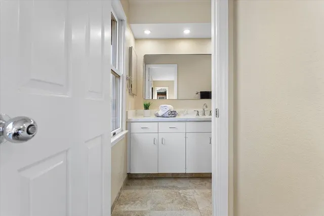 a view of a patio with a chairs and table in a patio