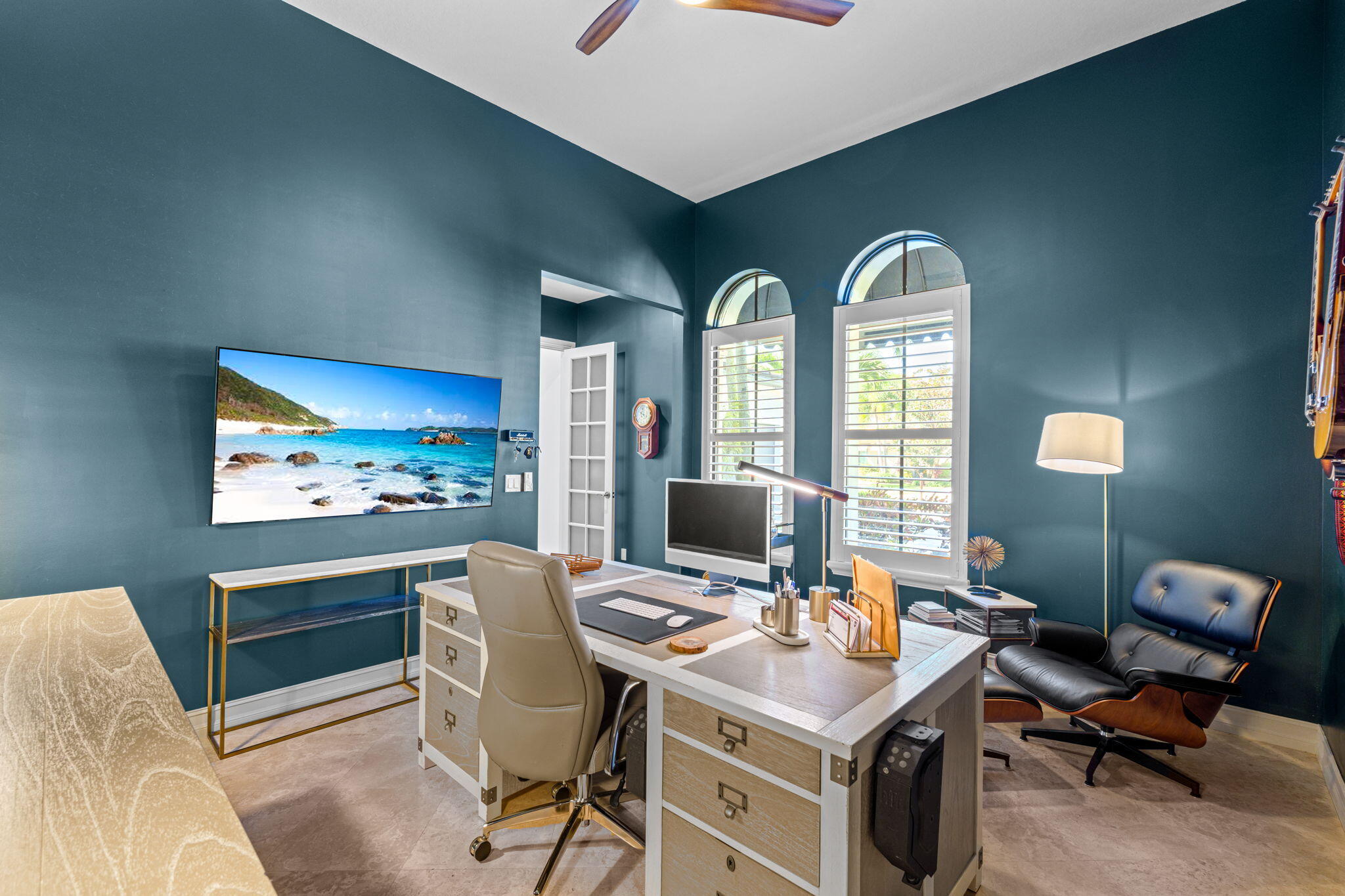 17814 Cadena Drive Boca Raton, FL 33496 - Photo 11 of 46 a view of a workspace with furniture and a flat screen tv