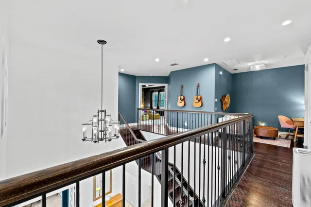 a bedroom with furniture and a large window