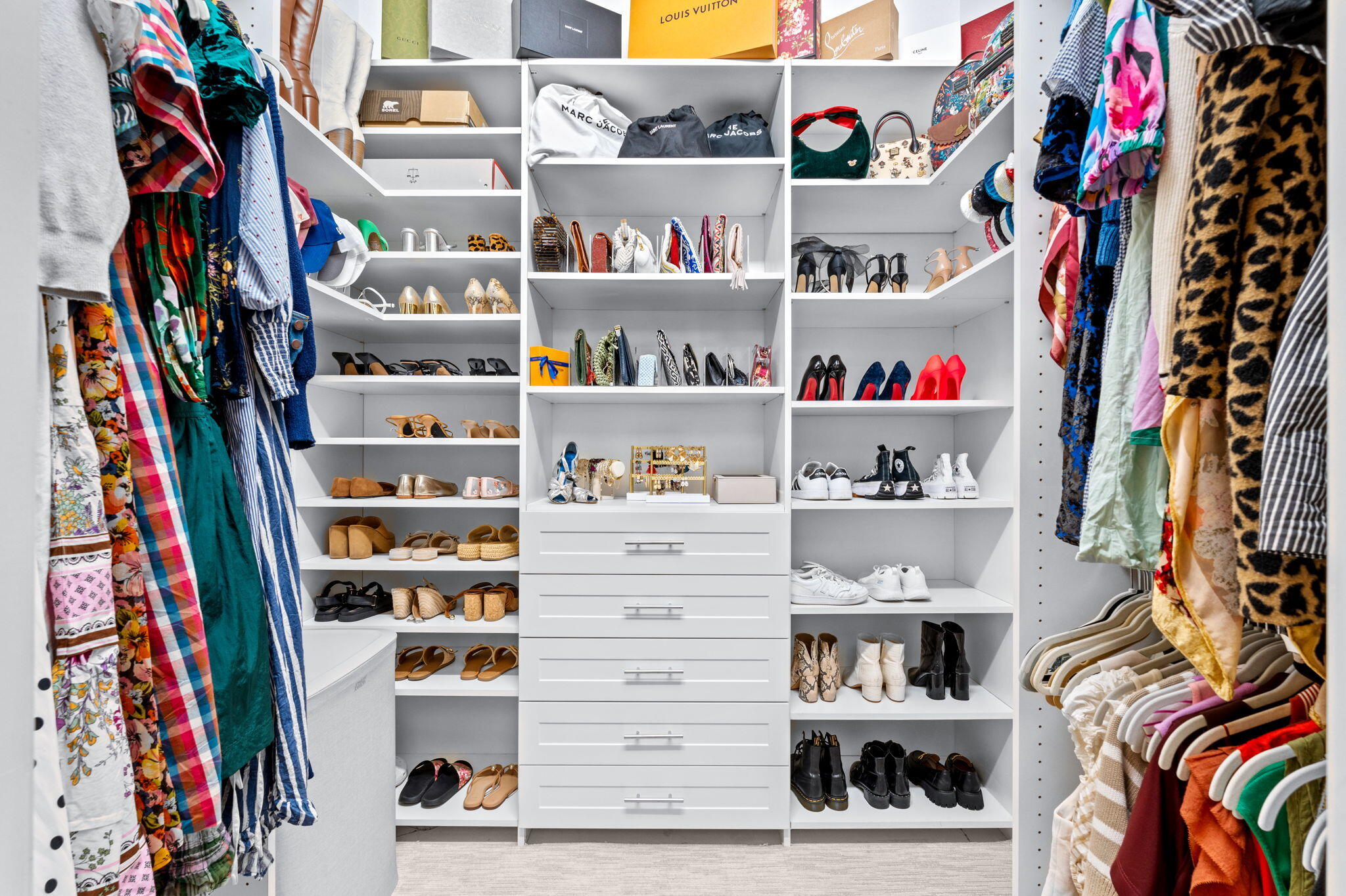 17814 Cadena Drive Boca Raton, FL 33496 - Photo 16 of 46 a view of walk in closet with clothes and shoes