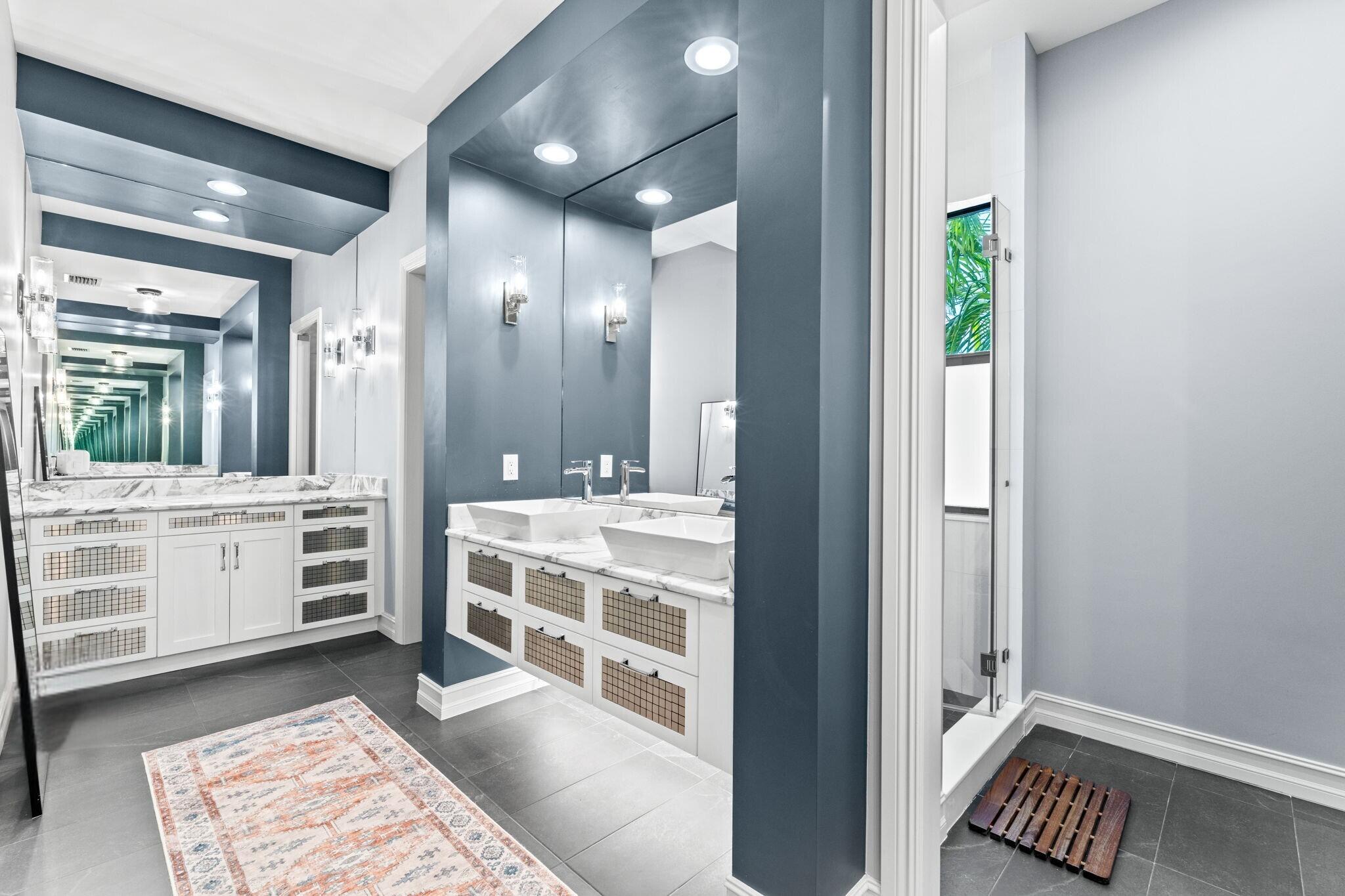 17814 Cadena Drive Boca Raton, FL 33496 - Photo 19 of 46 a bathroom with a double vanity sink and a mirror