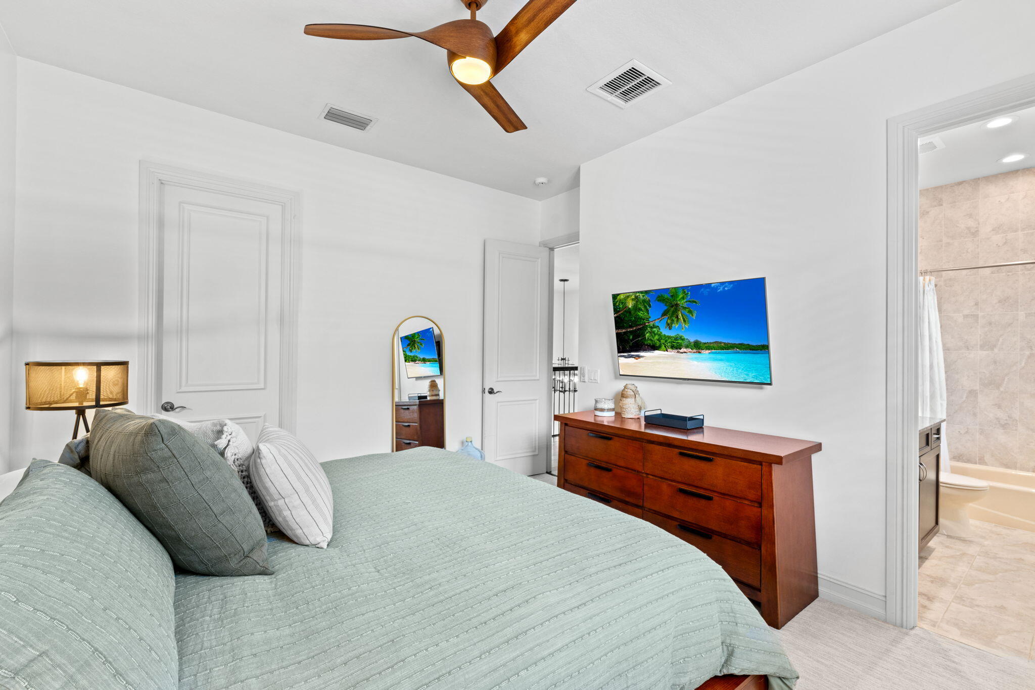 17814 Cadena Drive Boca Raton, FL 33496 - Photo 21 of 46 a bedroom with a bed and a flat screen tv