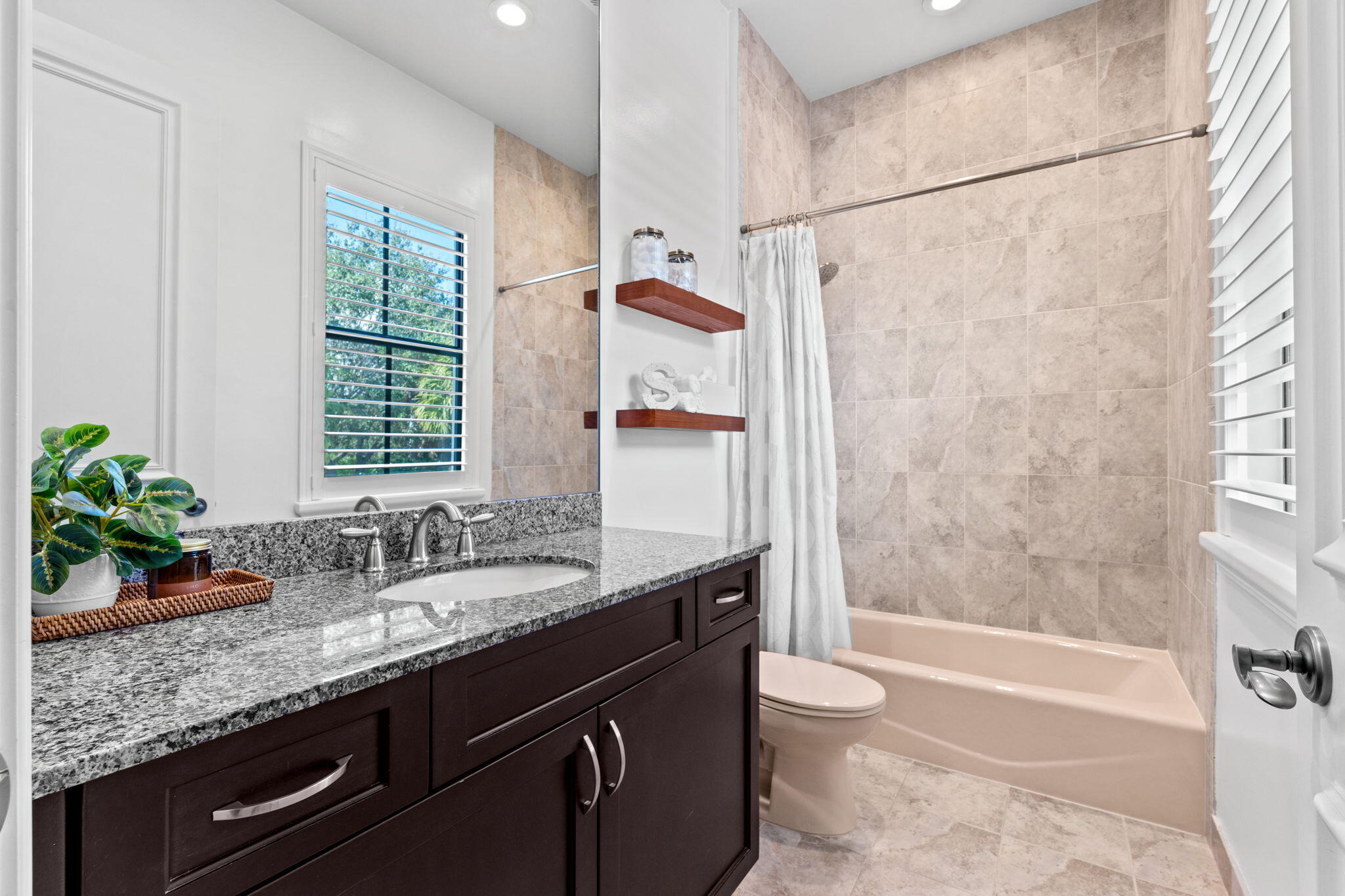 17814 Cadena Drive Boca Raton, FL 33496 - Photo 22 of 46 a bathroom with a granite countertop sink a toilet a mirror and shower