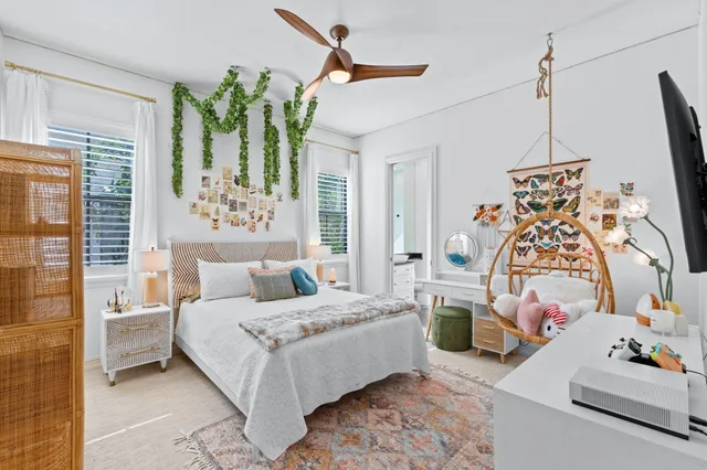 a bathroom with a sink a toilet and a large mirror