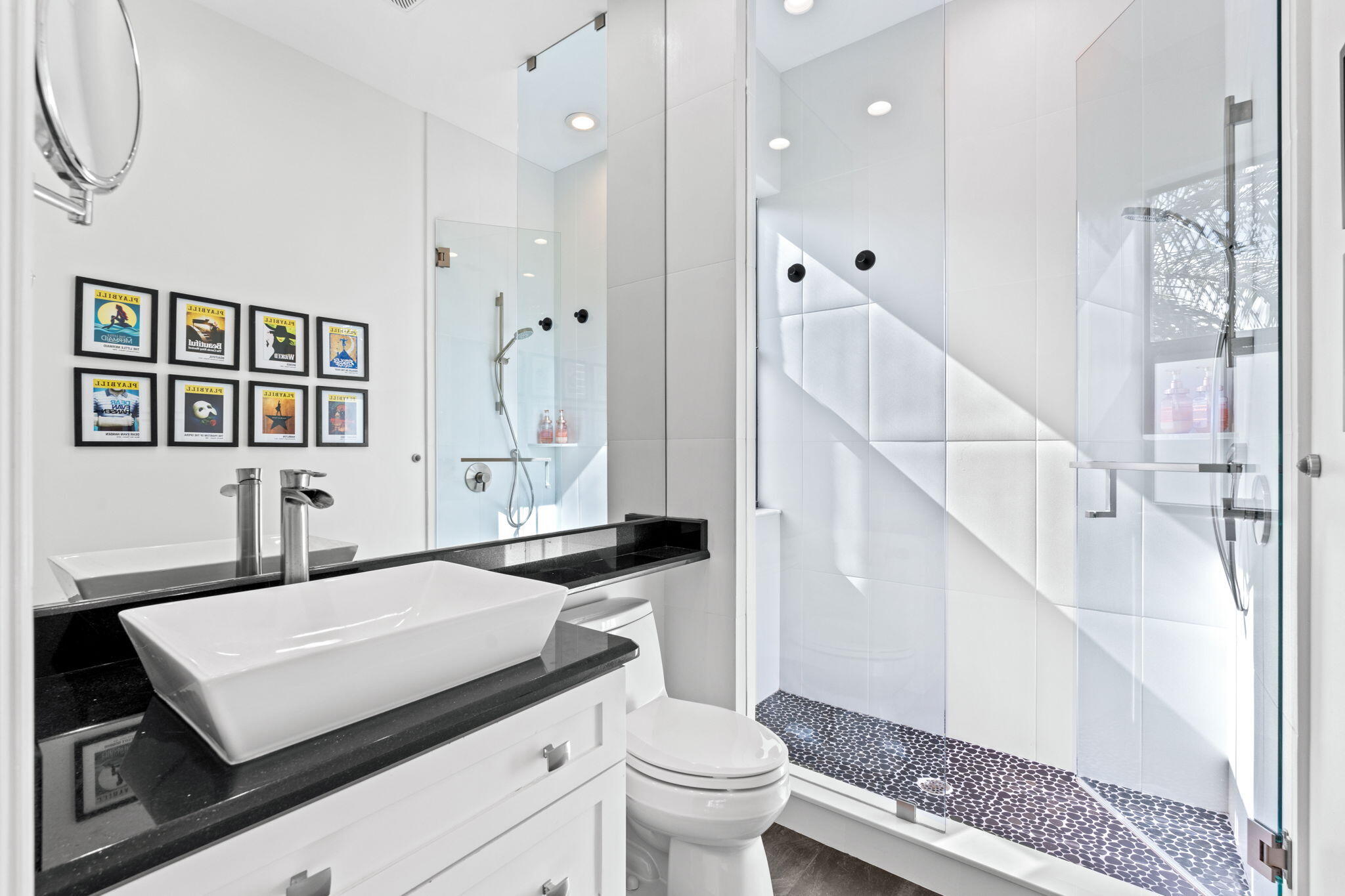 17814 Cadena Drive Boca Raton, FL 33496 - Photo 24 of 46 a bathroom with a sink a toilet and a large mirror