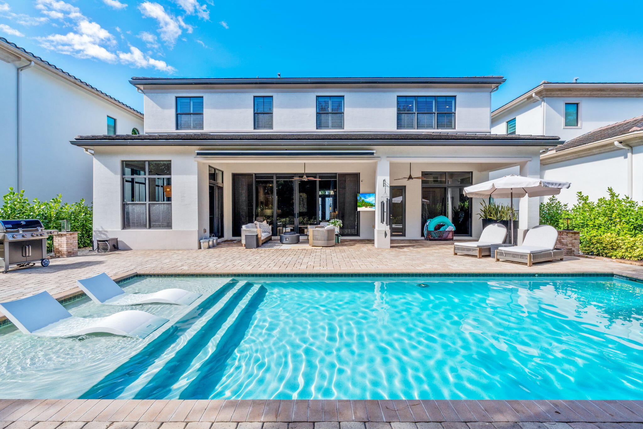 17814 Cadena Drive Boca Raton, FL 33496 - Photo 33 of 46 a view of a house with swimming pool and sitting area