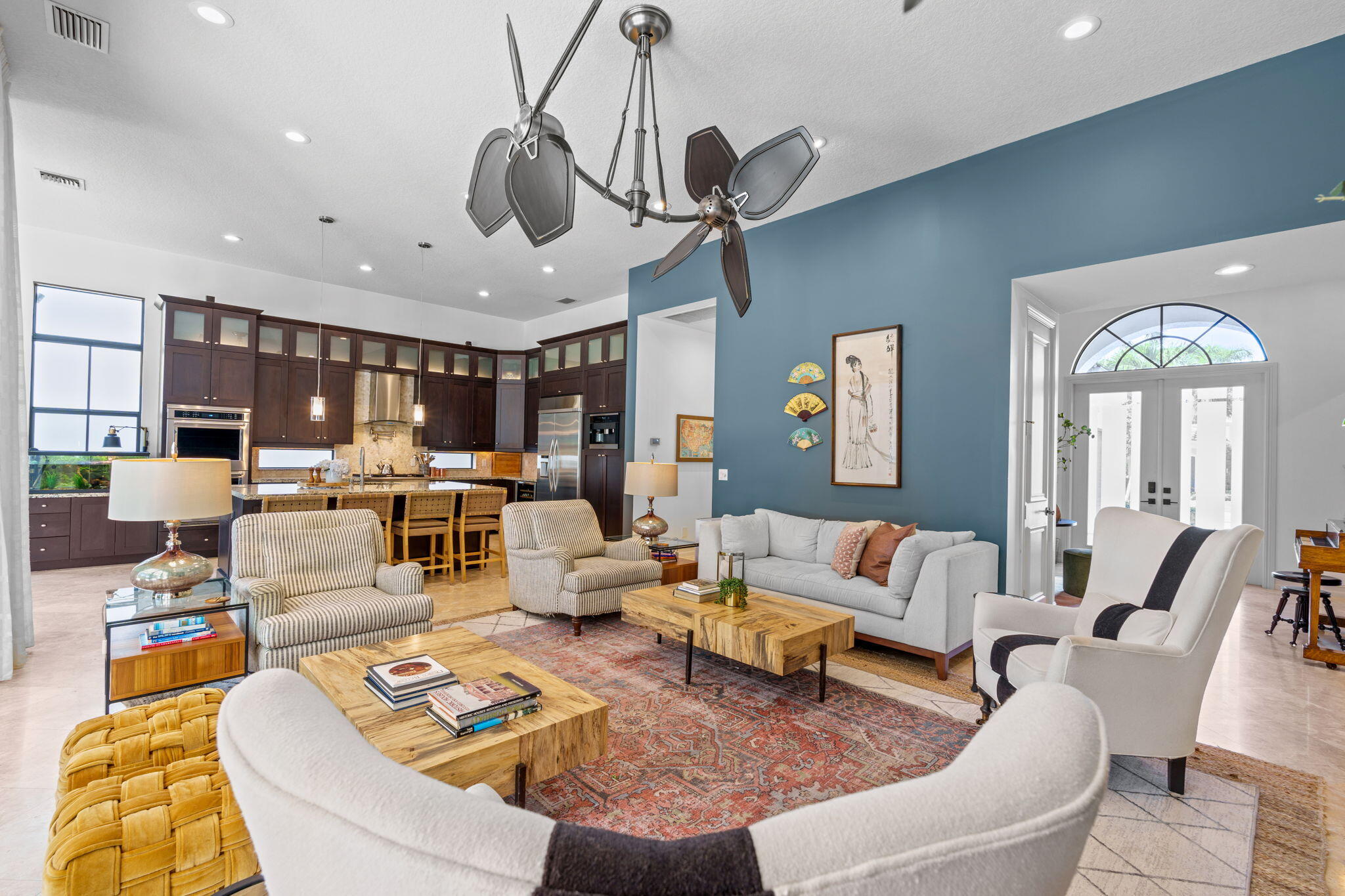 17814 Cadena Drive Boca Raton, FL 33496 - Photo 8 of 46 a living room with furniture kitchen view and a chandelier