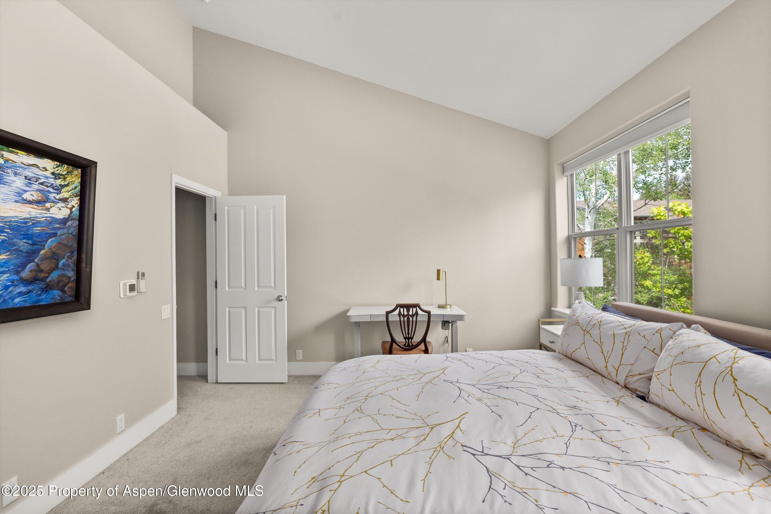 612 Evans Court Basalt, CO 81621 - Photo 7 of 17 a bedroom with a bed and a large window