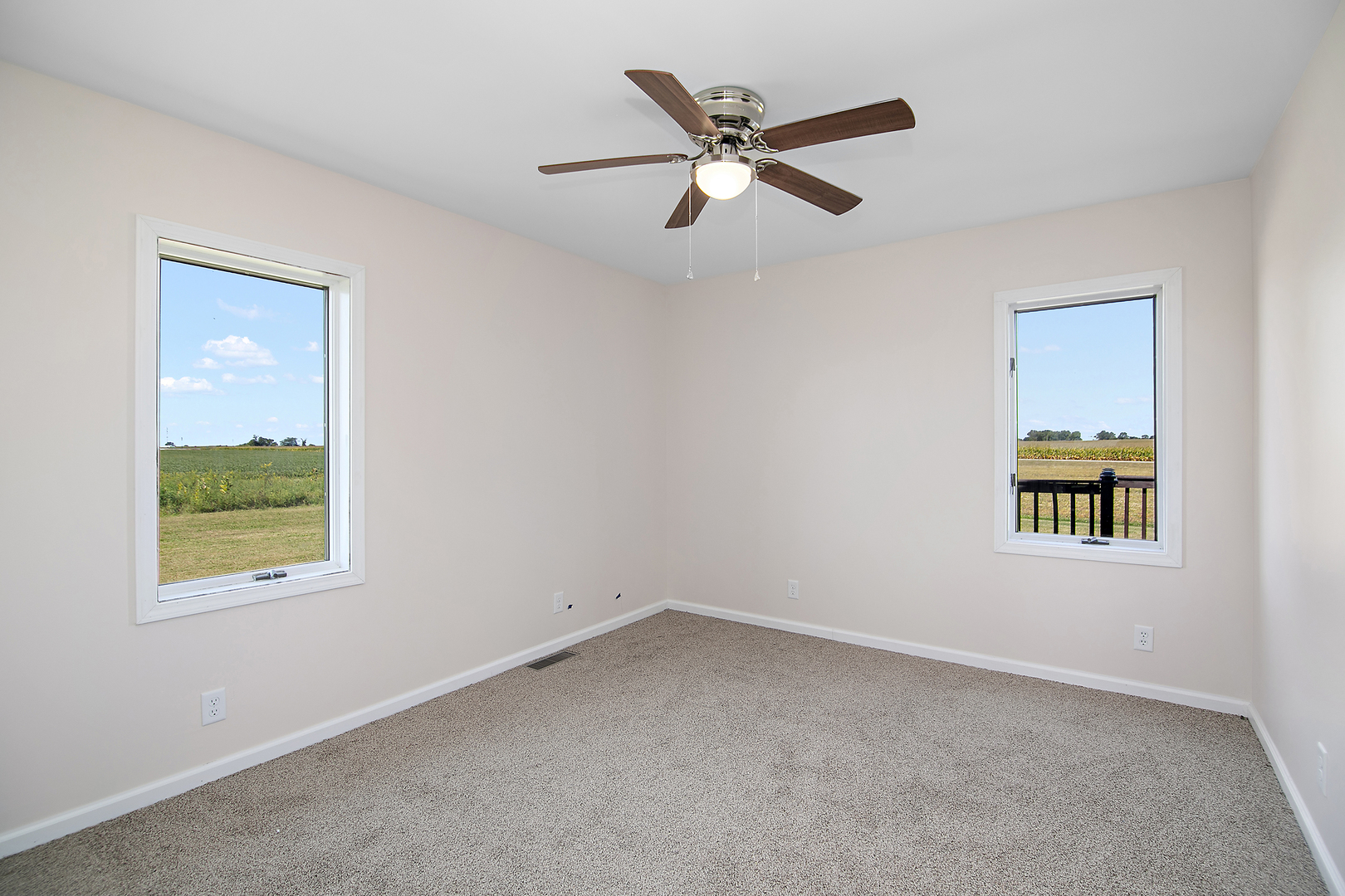 2695 North 1000 East Road Ashkum, IL 60911 - Photo 25 of 31 an empty room with windows and fan