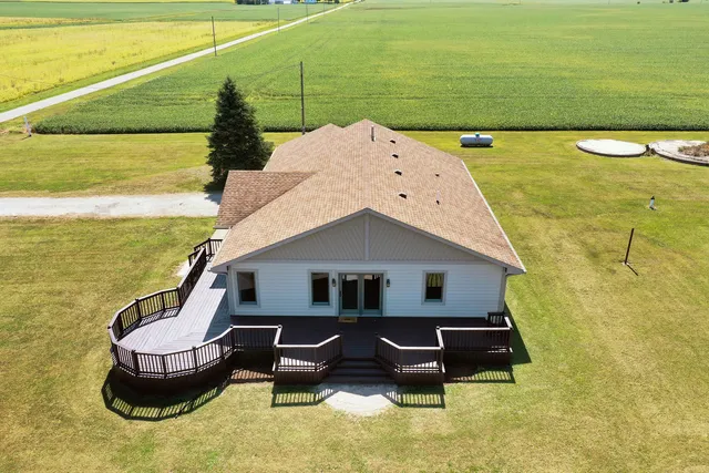 a balcony with table and chairs