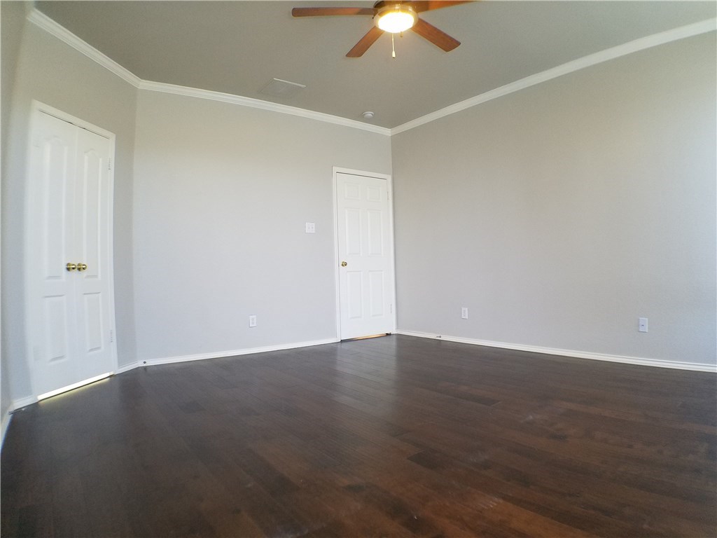 2208 Hayfield Square Pflugerville, TX 78660 - Photo 15 of 29 an empty room with a ceiling fan and a window