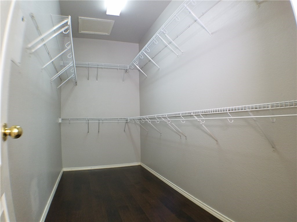 2208 Hayfield Square Pflugerville, TX 78660 - Photo 18 of 29 wooden floor in an empty room
