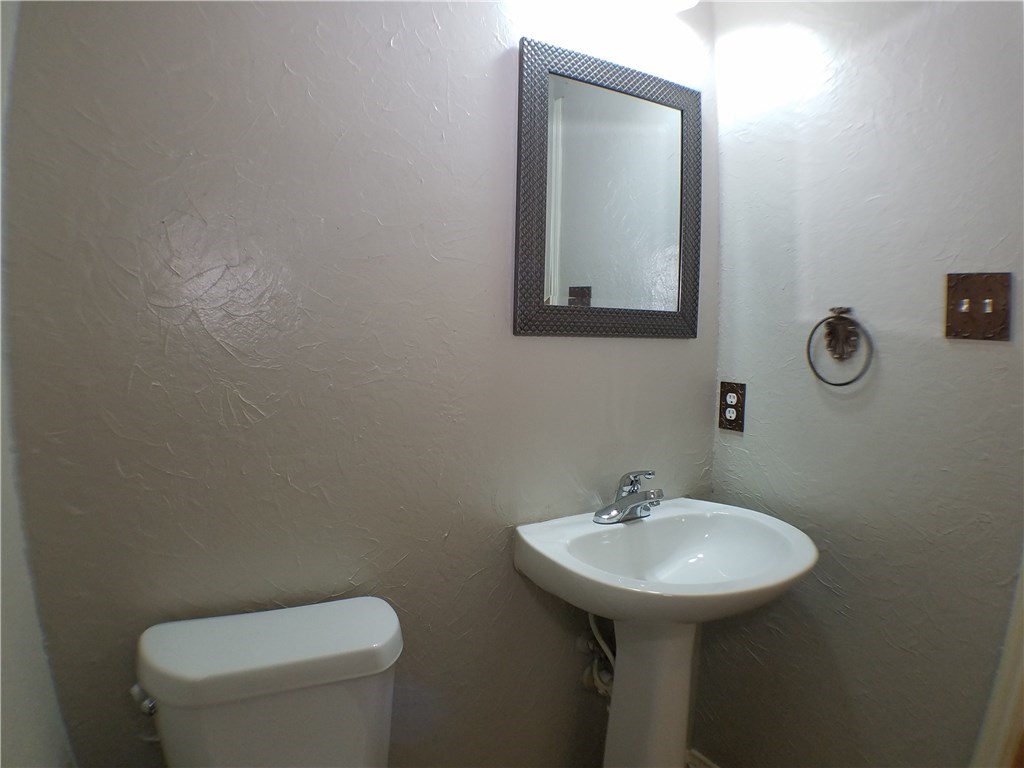 2208 Hayfield Square Pflugerville, TX 78660 - Photo 8 of 29 a bathroom with a toilet sink and mirror