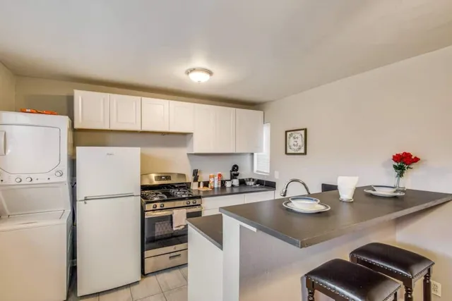 a kitchen with a sink a stove and refrigerator