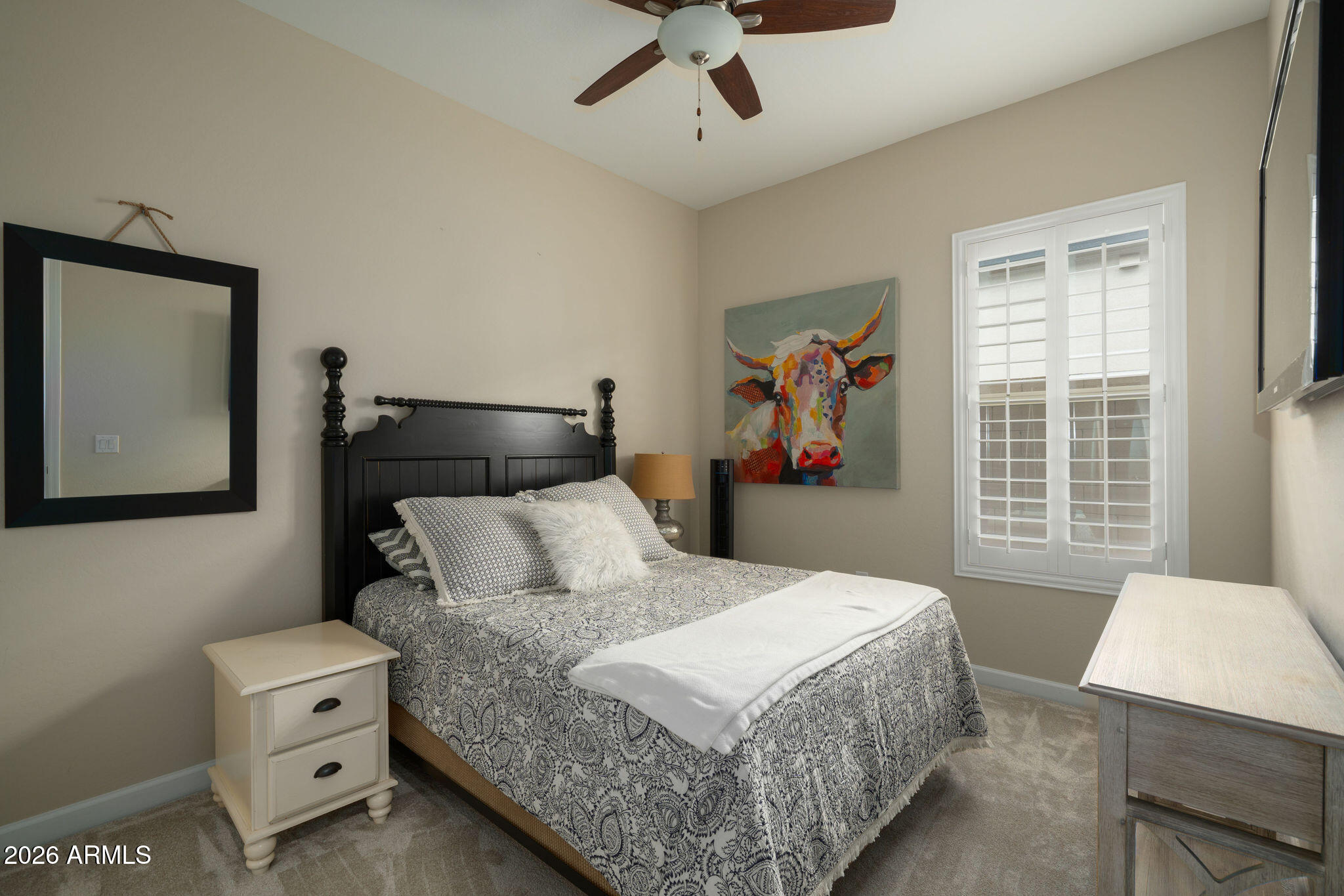 18236 North 66th Way Phoenix, AZ 85054 - Photo 12 of 17 a bedroom with a large bed and a window