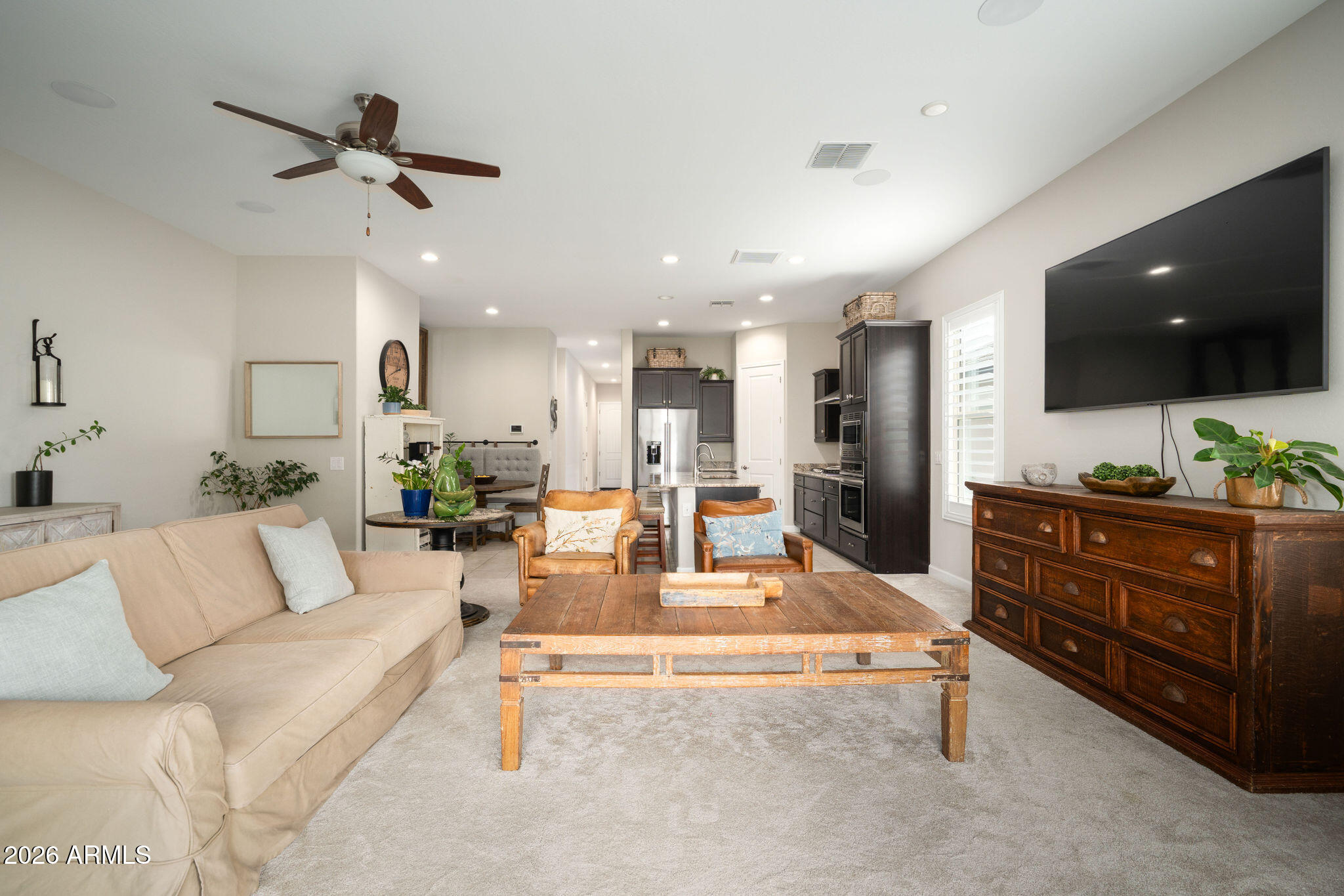 18236 North 66th Way Phoenix, AZ 85054 - Photo 14 of 17 a living room with furniture and a flat screen tv