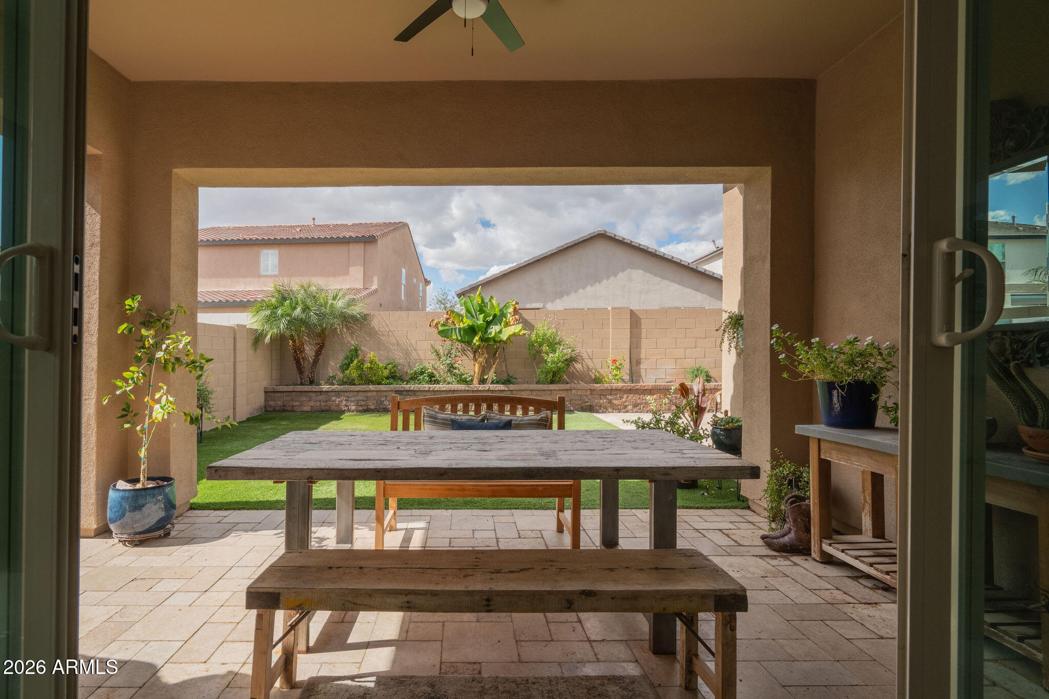 18236 North 66th Way Phoenix, AZ 85054 - Photo 16 of 17 a view of a patio with table and chairs under an umbrella