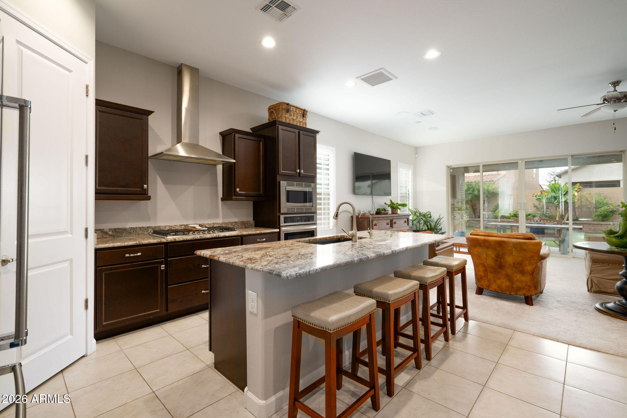 18236 North 66th Way Phoenix, AZ 85054 - Photo 2 of 17 a kitchen with granite countertop a sink counter top space appliances and cabinets