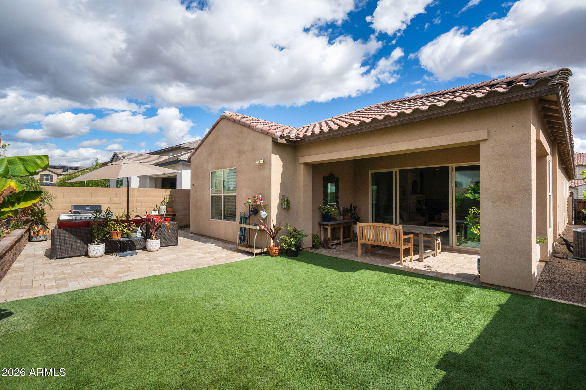 18236 North 66th Way Phoenix, AZ 85054 - Photo 3 of 17 a view of a house with backyard porch and sitting area