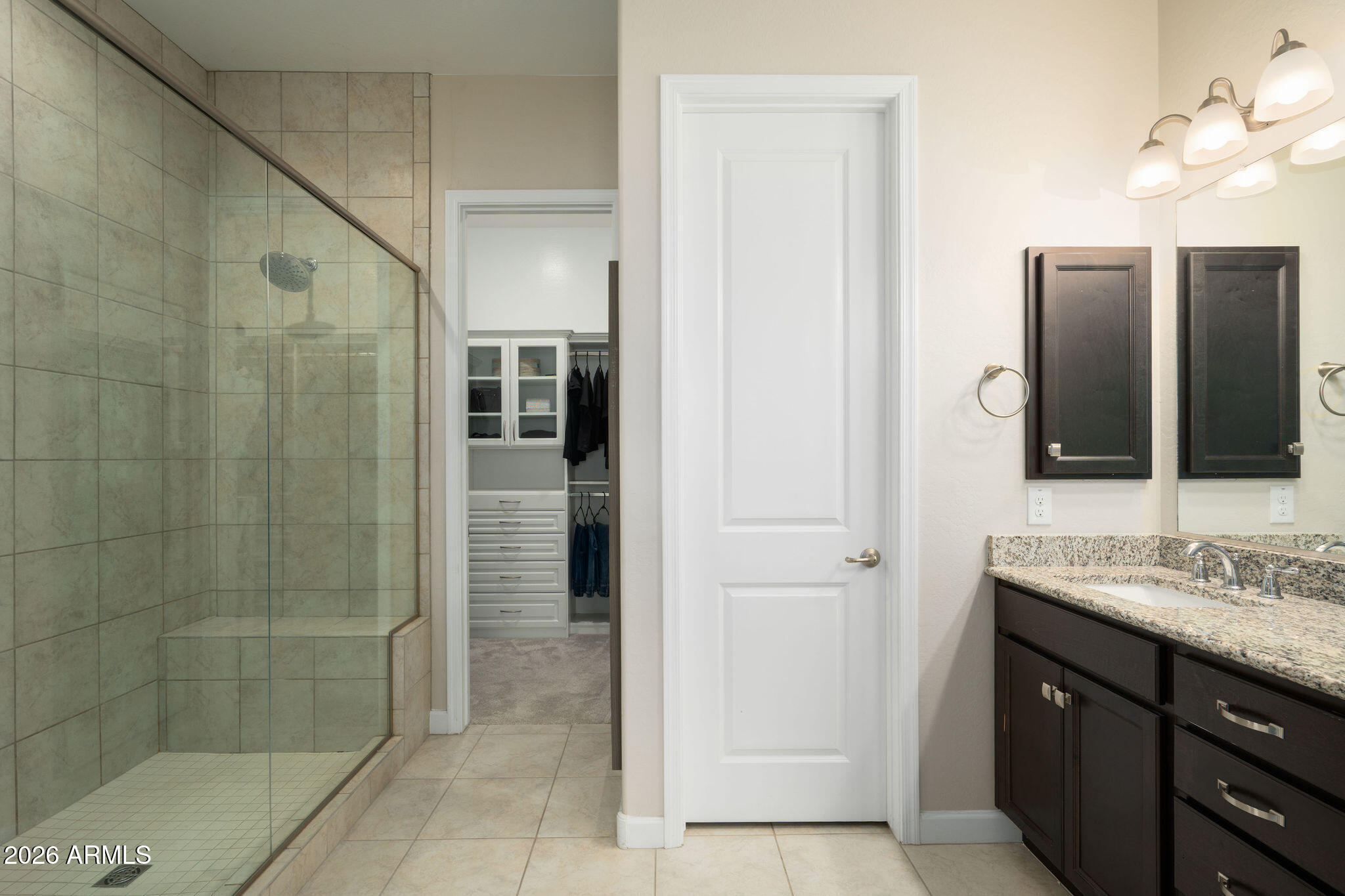 18236 North 66th Way Phoenix, AZ 85054 - Photo 6 of 17 a bathroom with a sink and a mirror