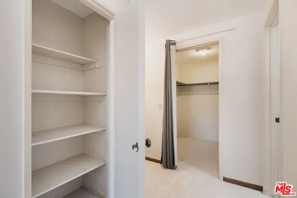 a view of an empty walk in closet