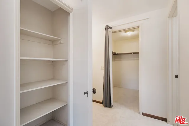 a view of an empty walk in closet