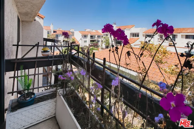 a view of street from balcony