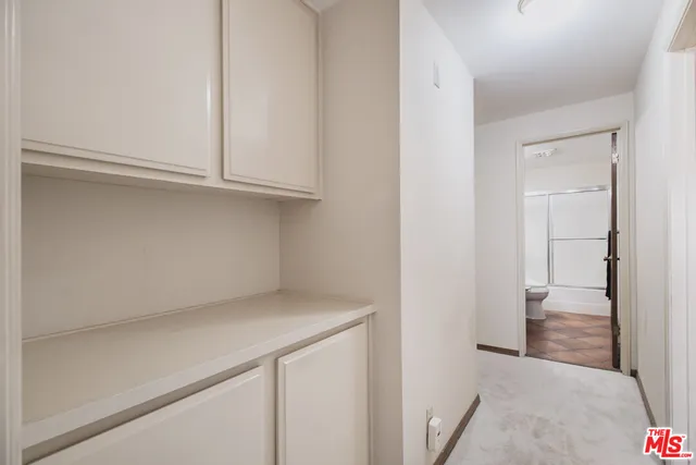 a view of storage and utility room with empty racks