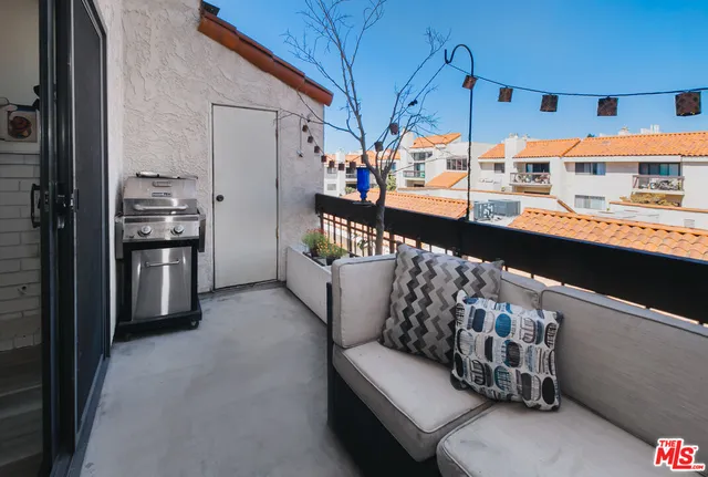 a kitchen with stainless steel appliances kitchen island granite countertop a refrigerator and a stove