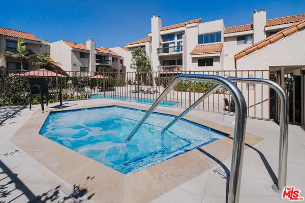 a view of a swimming pool with a patio