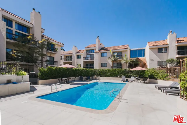 a view of a swimming pool with a patio