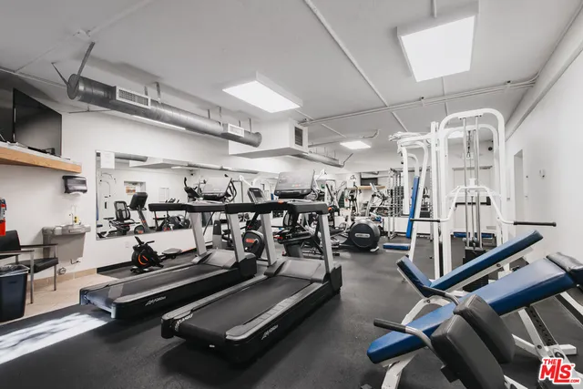 a view of a room with furniture and wooden floor