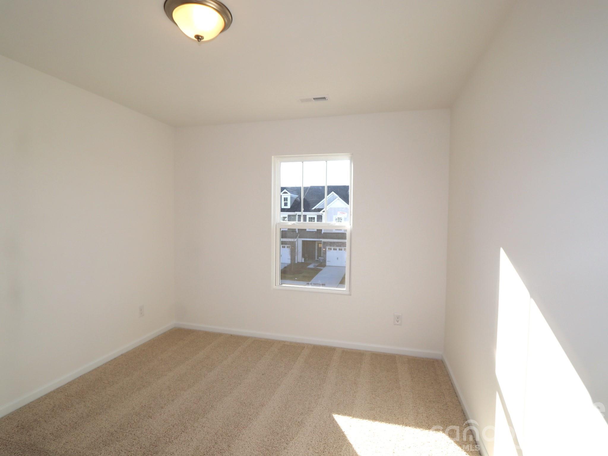 1110 Overbrook Place Wingate, NC 28174 - Photo 12 of 21 an empty room with a window