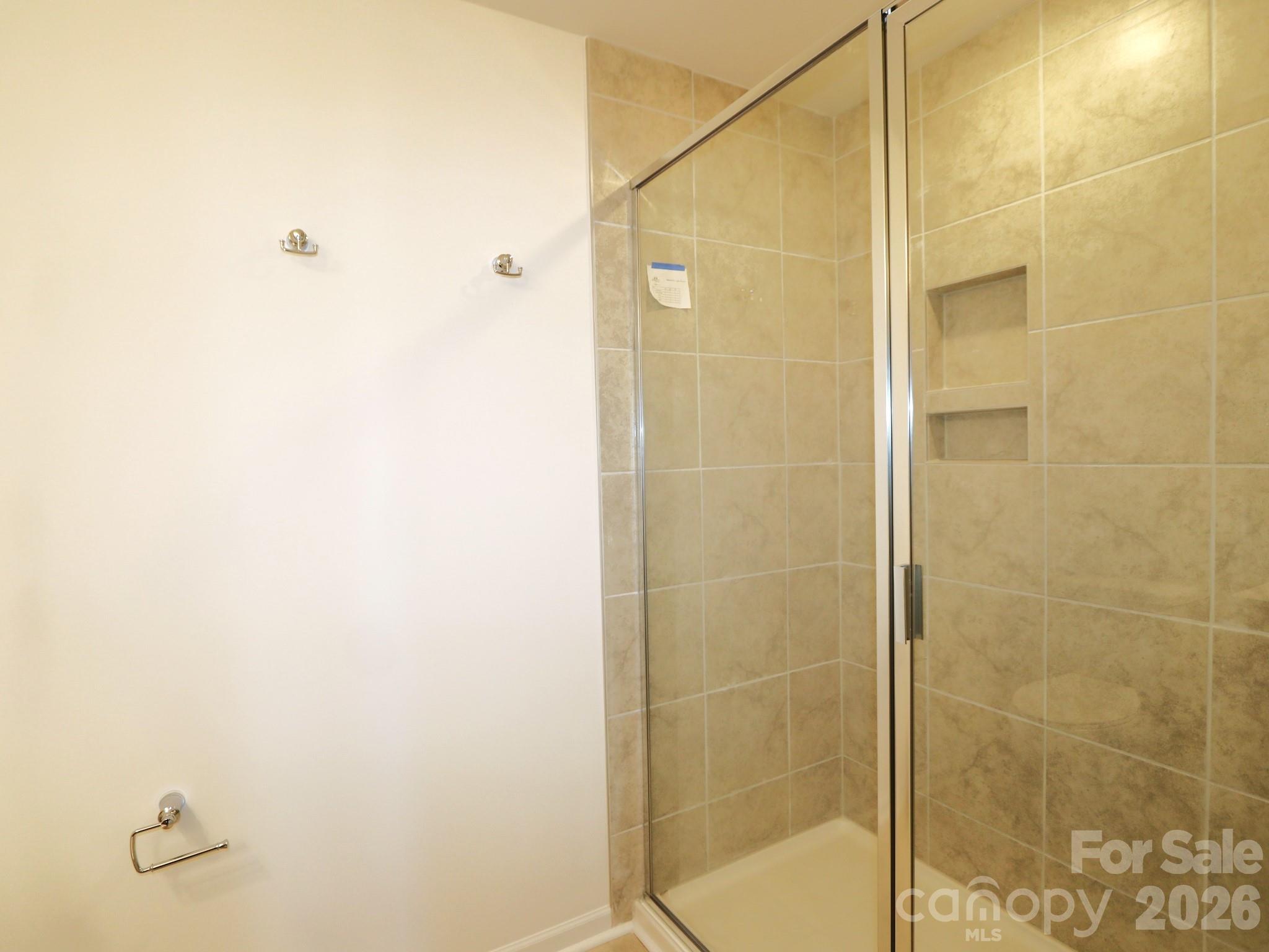 1110 Overbrook Place Wingate, NC 28174 - Photo 20 of 21 a bathroom with a shower
