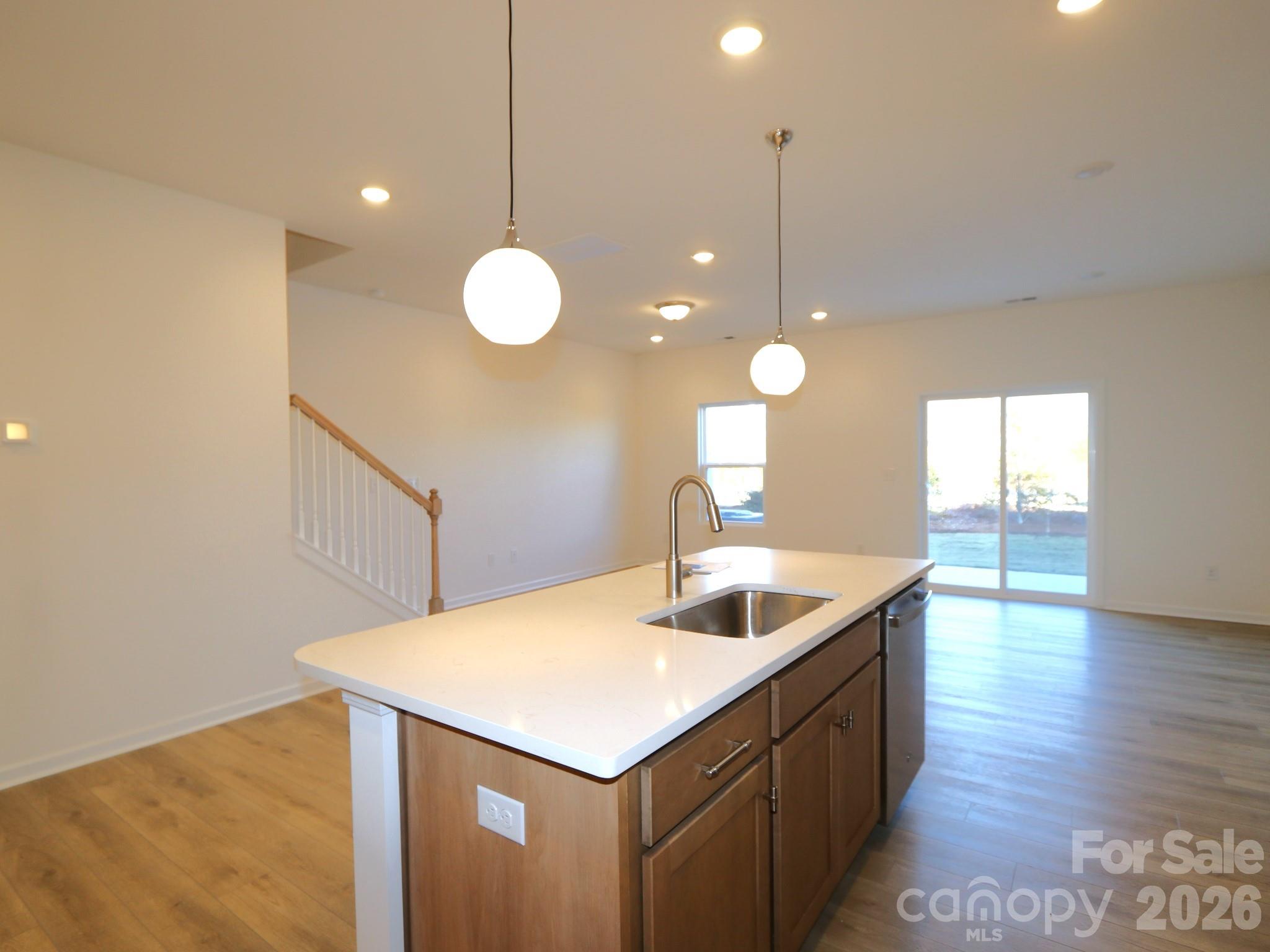 1110 Overbrook Place Wingate, NC 28174 - Photo 6 of 21 a kitchen with a sink and chandelier