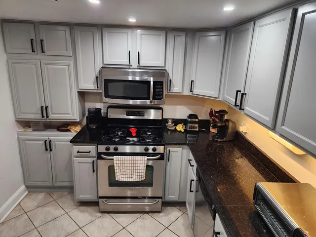 a kitchen with a stove and a microwave