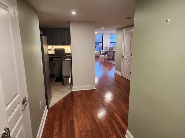 a view of a kitchen from the hallway