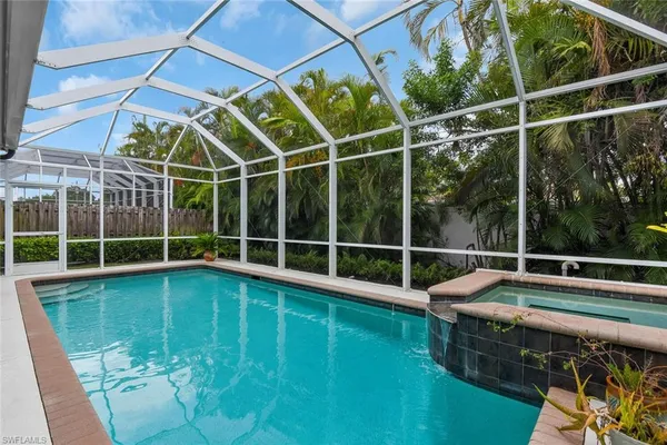 a view of a backyard with a swimming pool