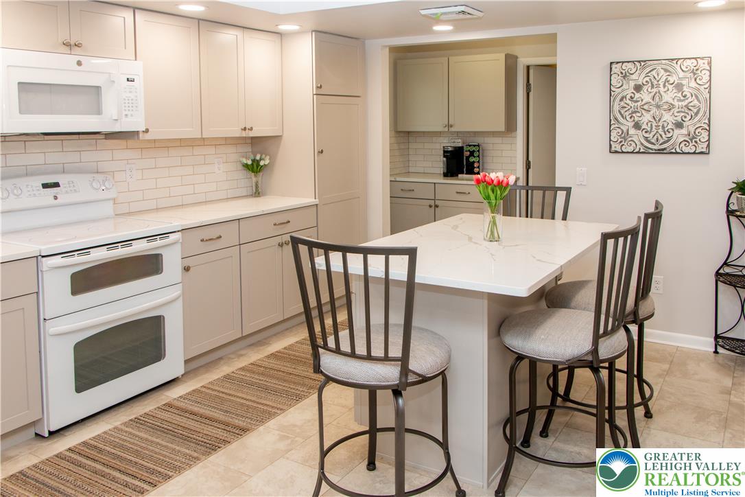 700 Newlins Road East Easton, PA 18040 - Photo 6 of 42 Culinary creations come to life in this kitchen, complete with a generous island offering a casual dining space.