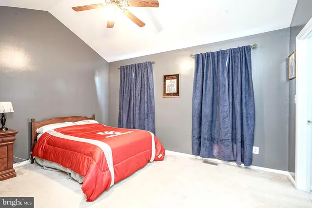 a bedroom with a bed and a closet