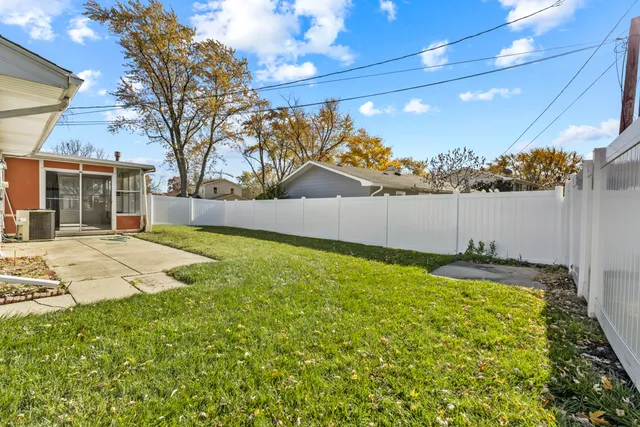 a view of a backyard of the house