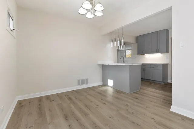a view of kitchen with wooden floor