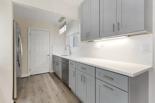 a view of a kitchen with electric appliances