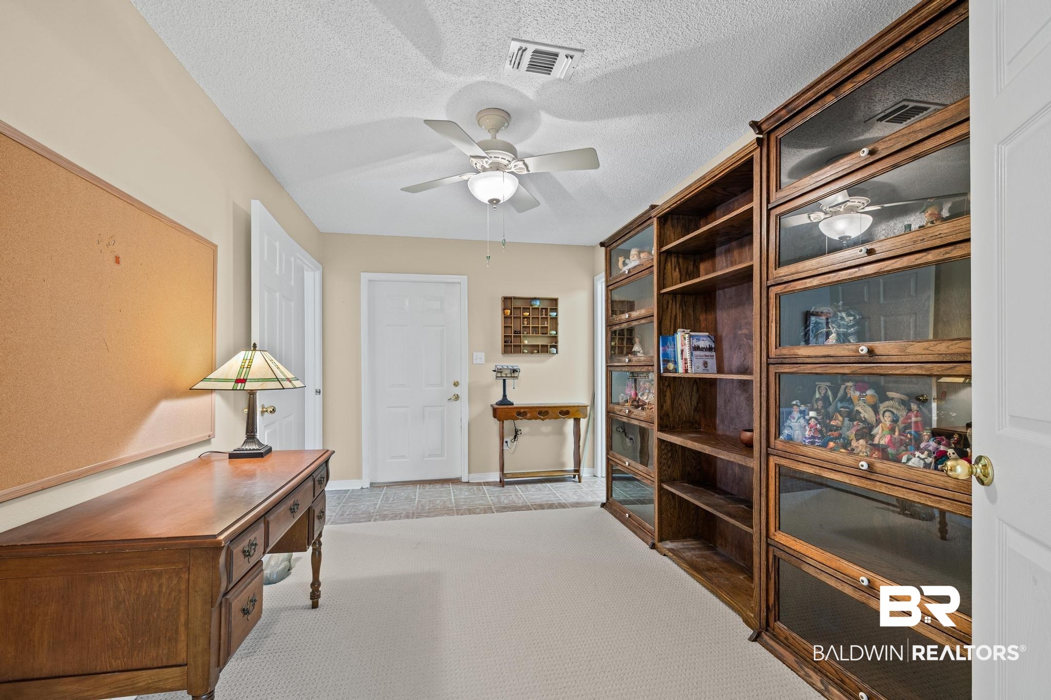 2881 Eslava Circle Lillian, AL 36549 - Photo 16 of 58 Living area with ceiling fan and a textured ceiling