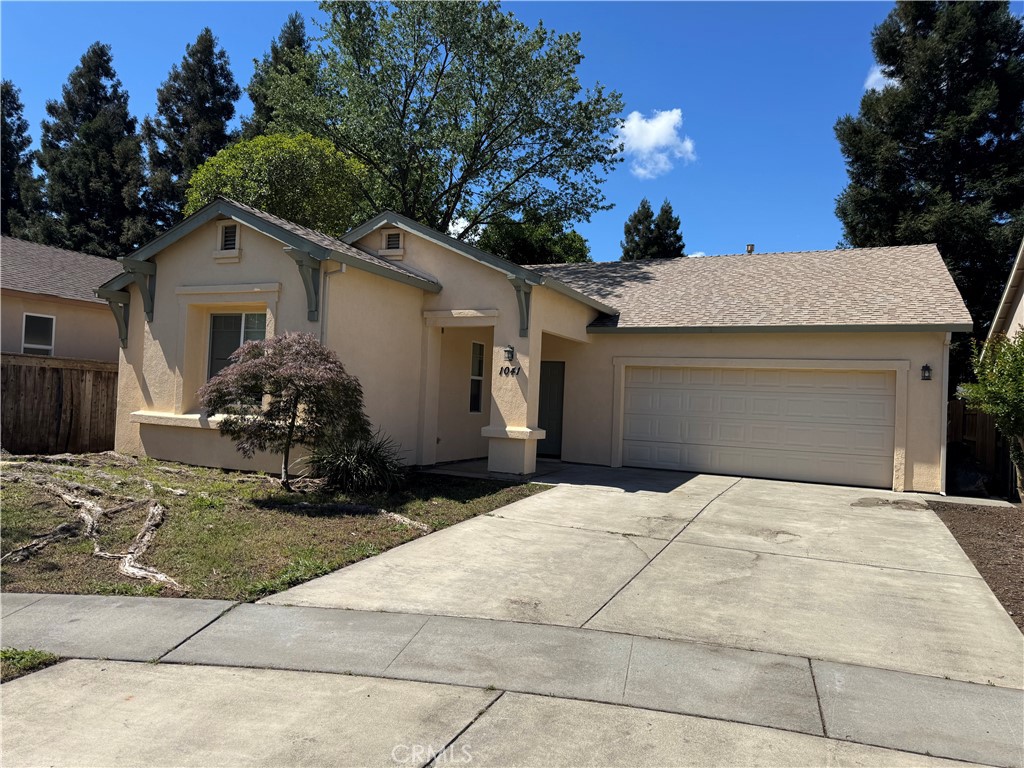 1041 Raven Lane Chico, CA 95926 - Photo 1 of 19 a house with yard in front of it