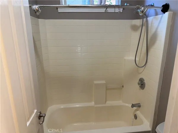a bathroom with a bath tub