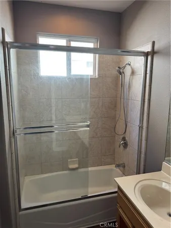 a bathroom with a sink and a bathtub