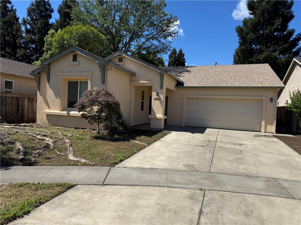 1041 Raven Lane Chico, CA 95926 - Photo 2 of 19 a front view of a house with garden