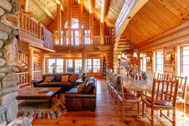 a living room with lots of furniture and a chandelier